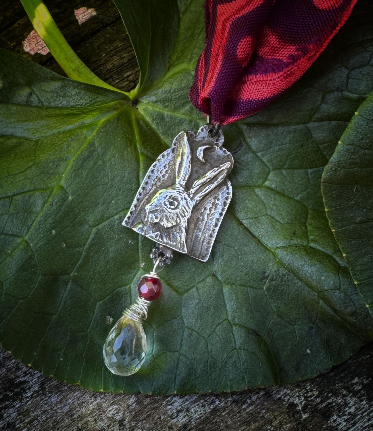 Hare pendant on recycled sari silk ribbon