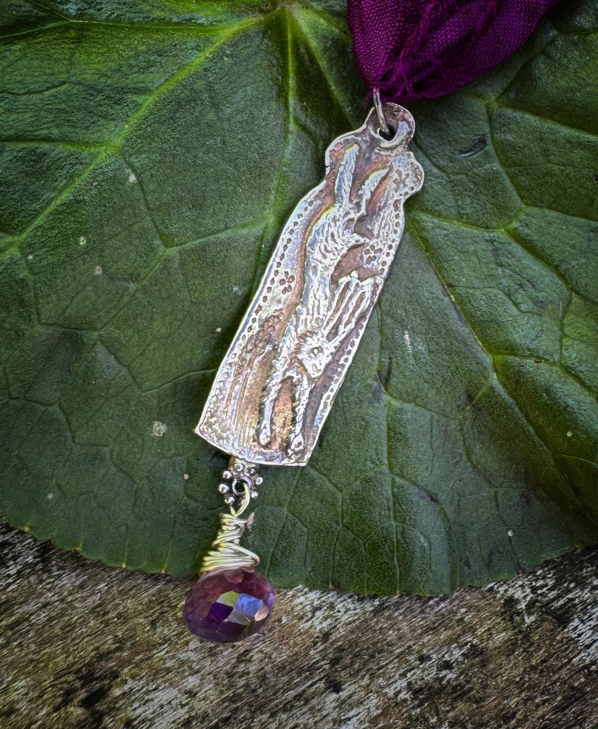 Hare pendant on recycled sari silk ribbon