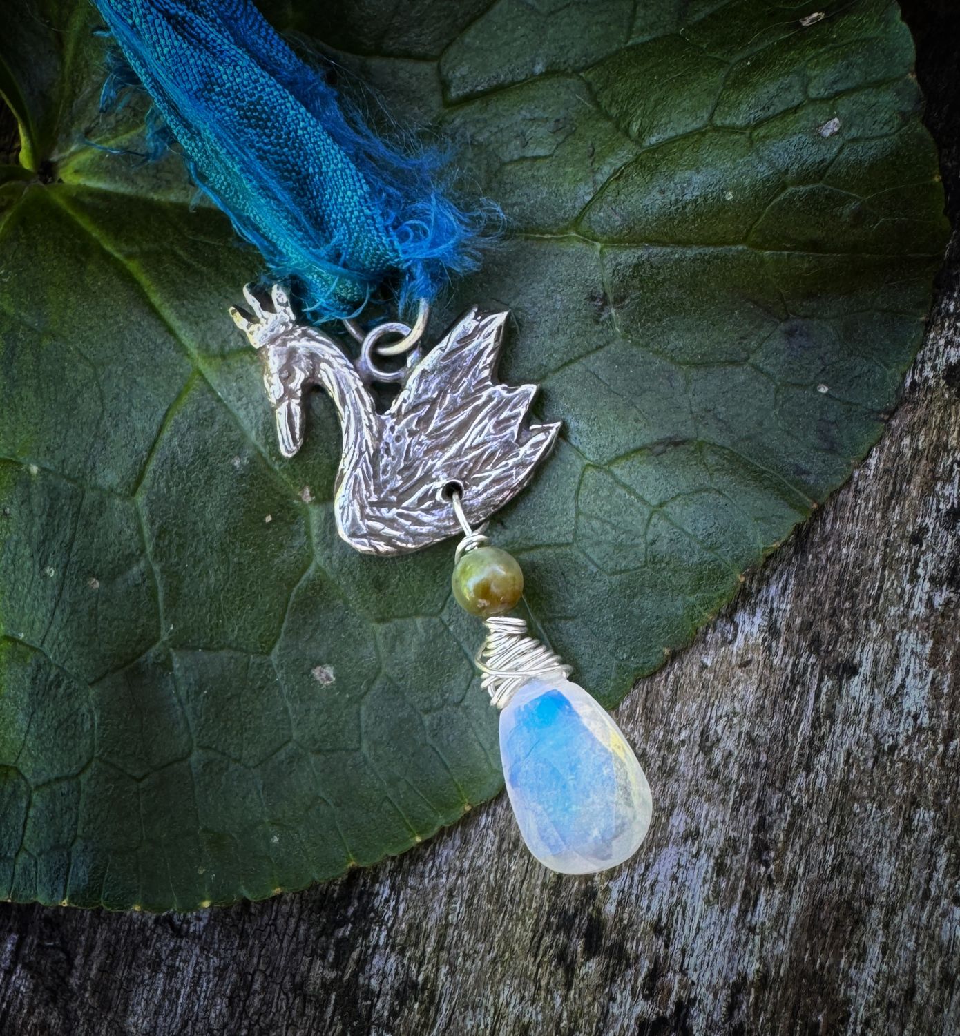 Swan pendant on recycled sari silk ribbon