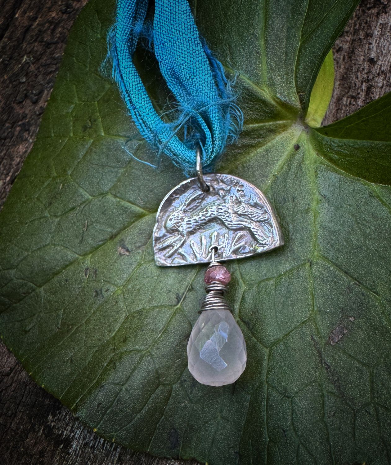 Hare pendant on recycled sari silk ribbon