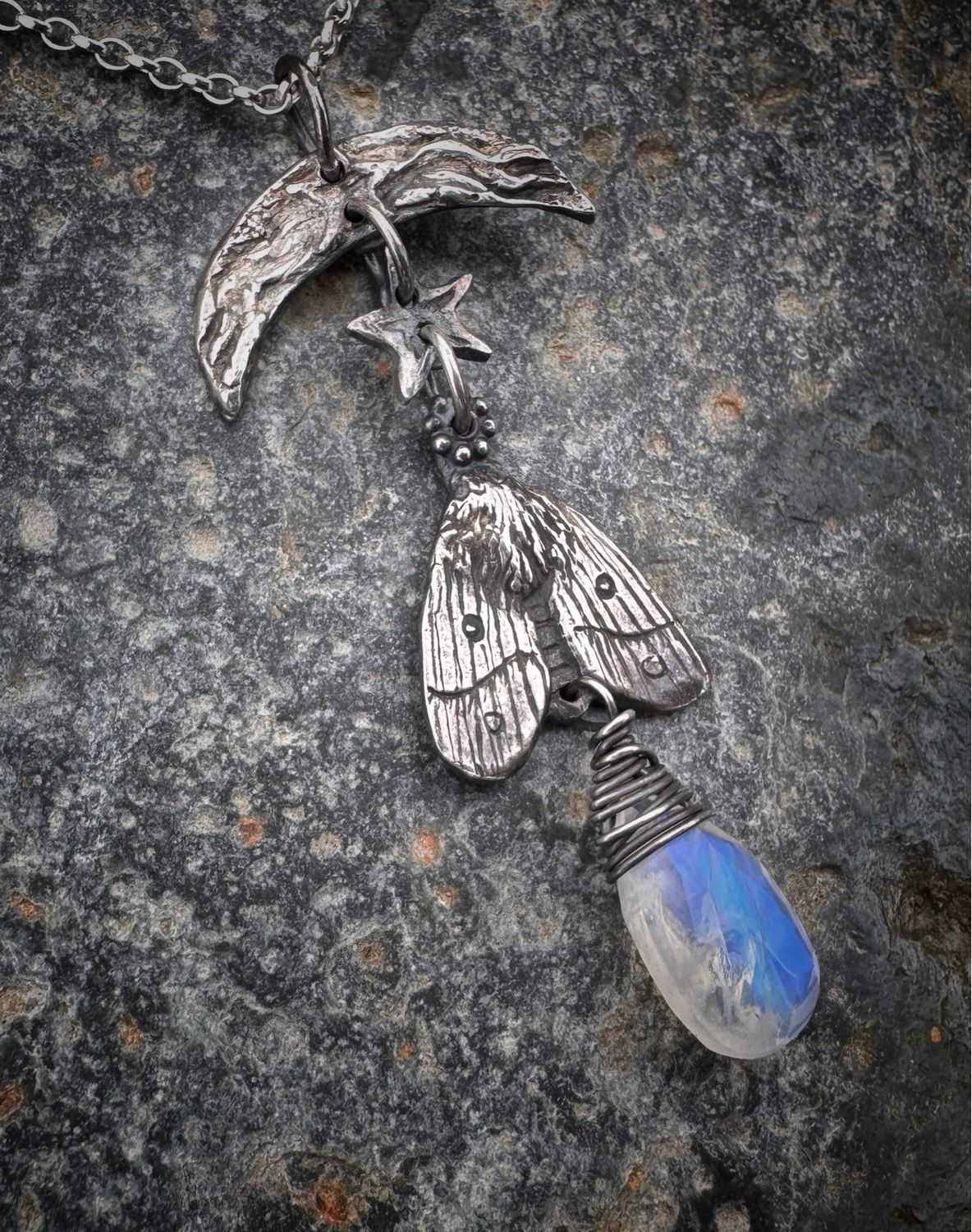 Moth And Moon Pendant On Silver Chain