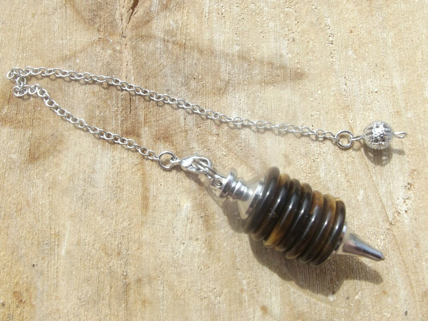 Large pendule en oeil de tigre