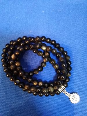 Mala obsidienne dorée