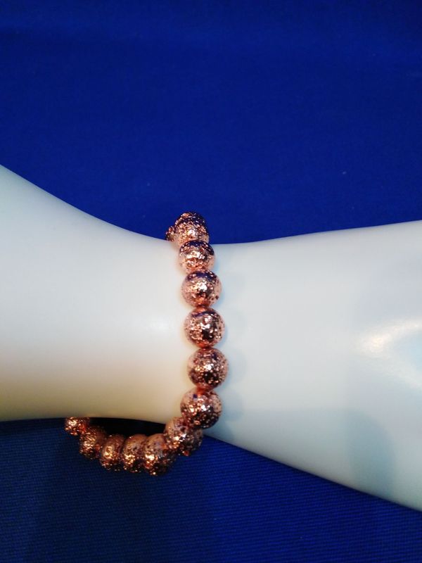 Bracelet fantaisie pierre de lave cuivrée