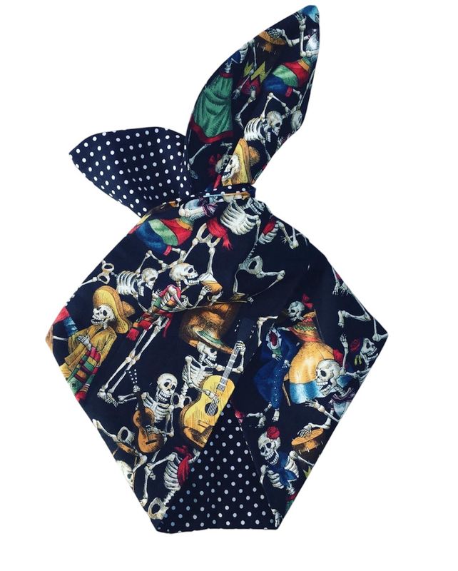 Day of the dead dancing skulls with black polka dot