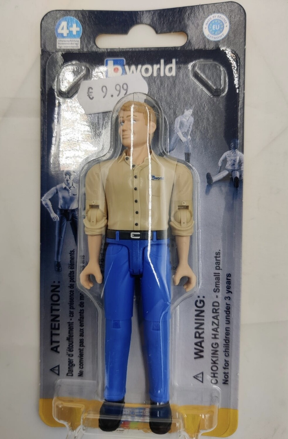 Bruder World Farmer figure with wheelbarrow and farming tools

