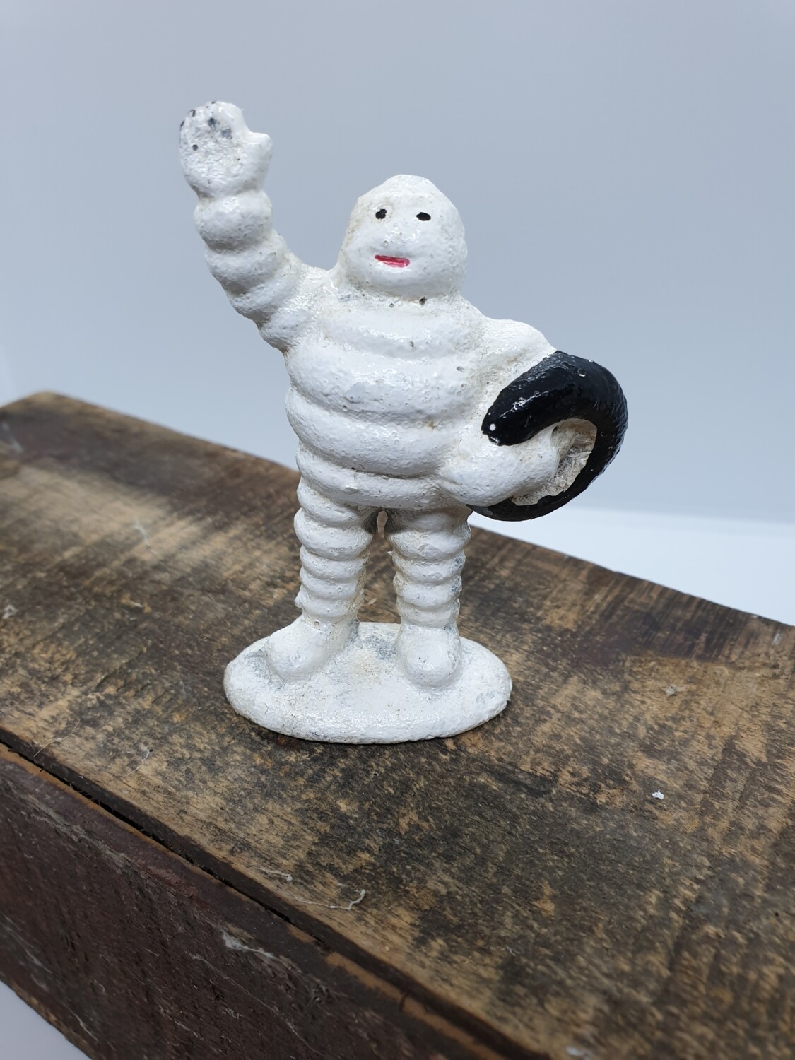 MICHELIN MAN WITH TYRE CAST IRON