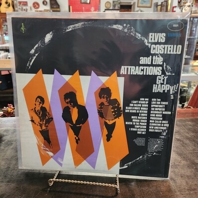 ELVIS COSTELLO AND THE ATTRACTIONS GET HAPPY