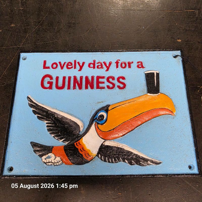 LOVELY DAY FOR A GUINNESS CAST IRON SIGN