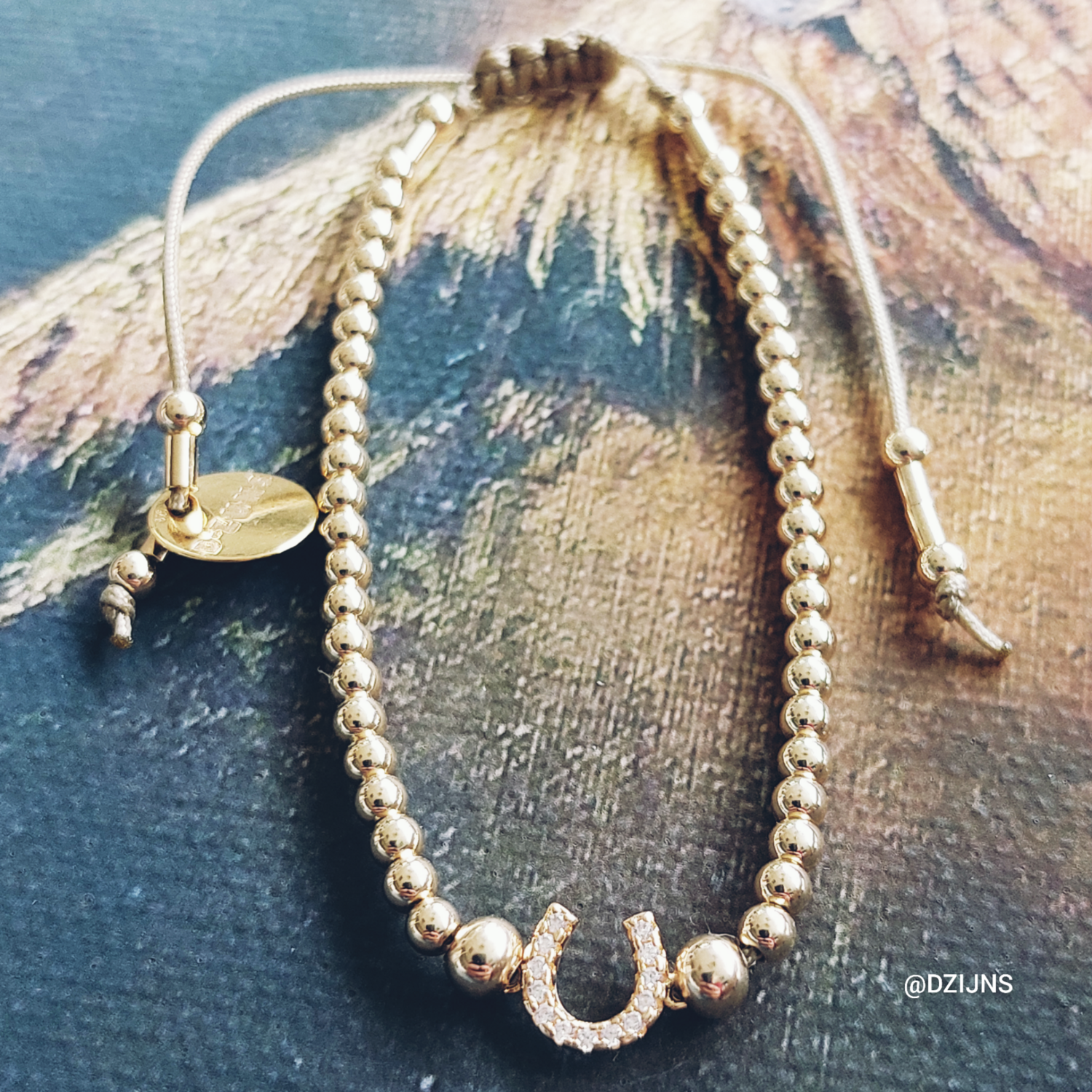 D-ZIJNS HOEFIJZER BAL 3MM GOUD