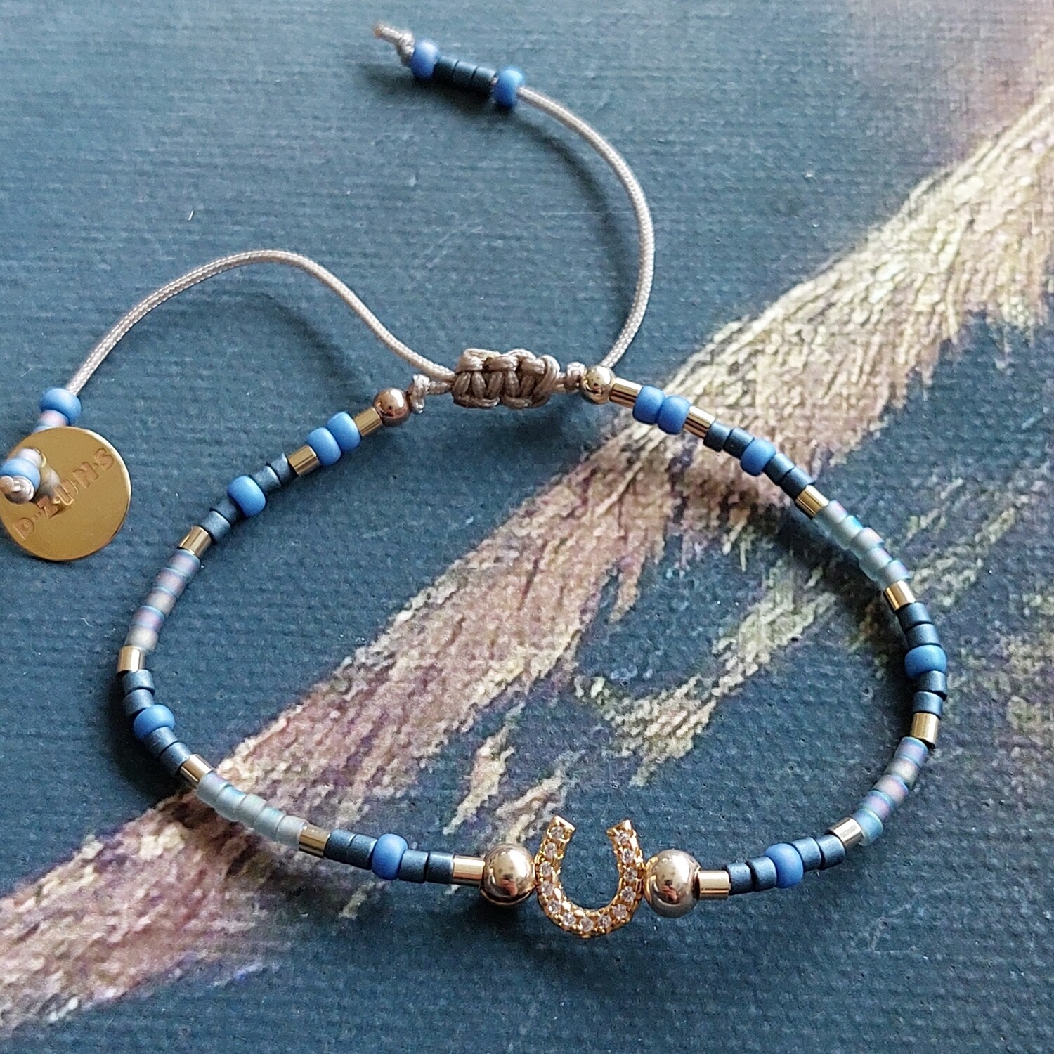 D-ZIJNS HOEFIJZER BLAUW GOUD