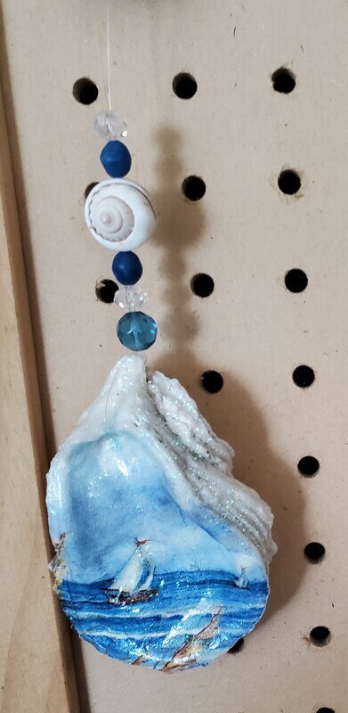 Oyster shell with sailboat and beads