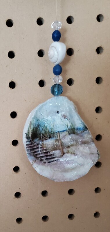 Oyster shell with steps going to the beach with beads
