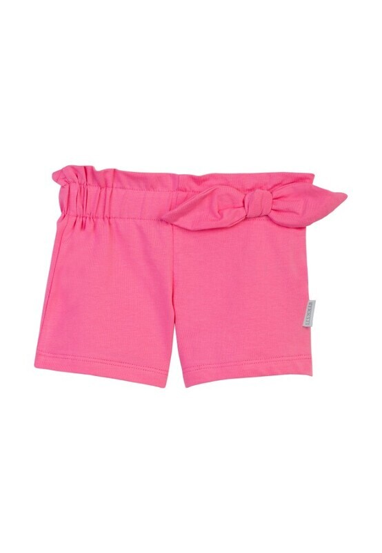 Short rose vif en jersey avec un noeud en déco à la taille