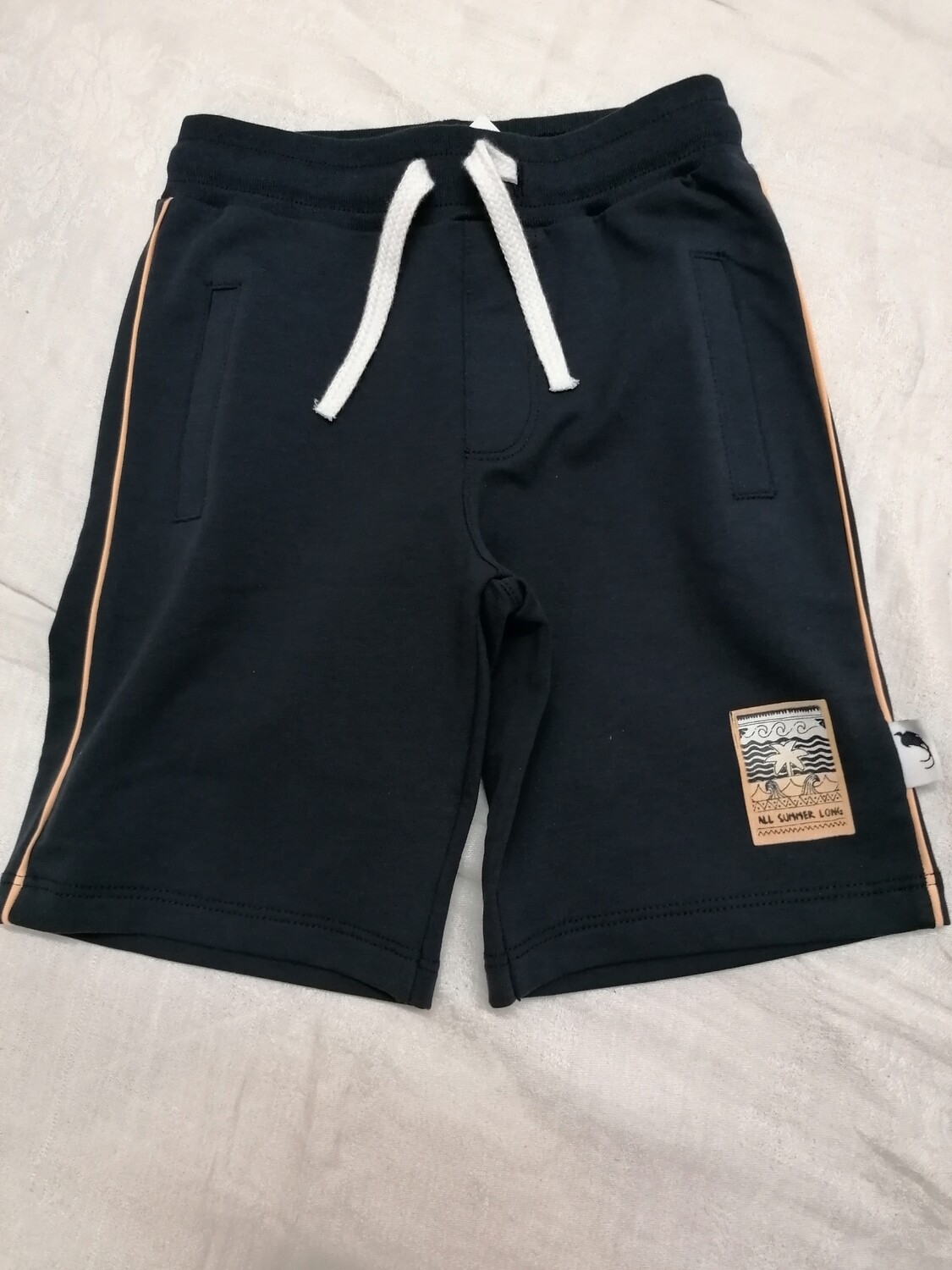 Short Bermudas en Jersey marine avec liseré orange