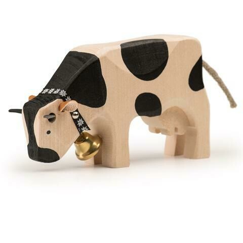 Trauffer Vache  noire en bois qui mange,  no 1019, fabriqué en Suisse