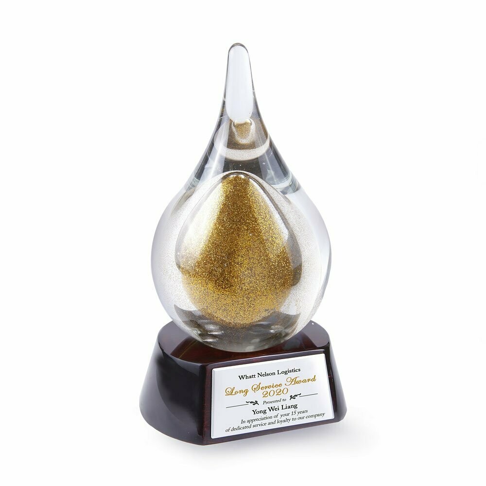 Golden Droplet on Piano Wood Base