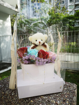 Soap roses with tiny bear in carrier box