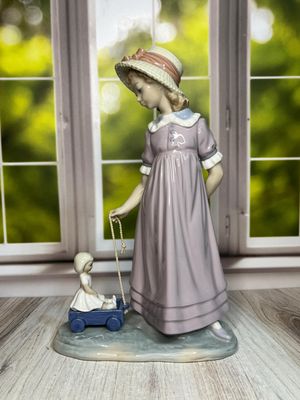 Lladro Girl with Toy Wagon #5044 Lladro Girl with Toy Wagon #5044