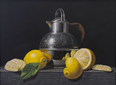 Silver water jug with lemons