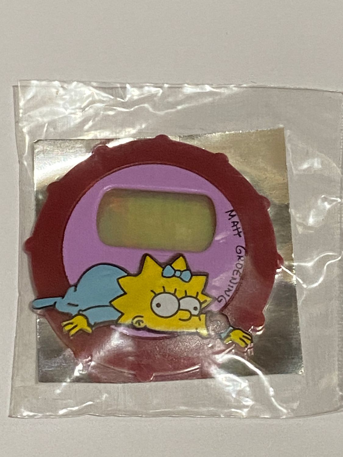 Sorpresa Kinder Brioss The Simpsons Maggie suck- copri orologio