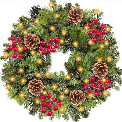 18 INCH Christmas Pine Wreath with Florals and Lights and a Timer for the Lights.