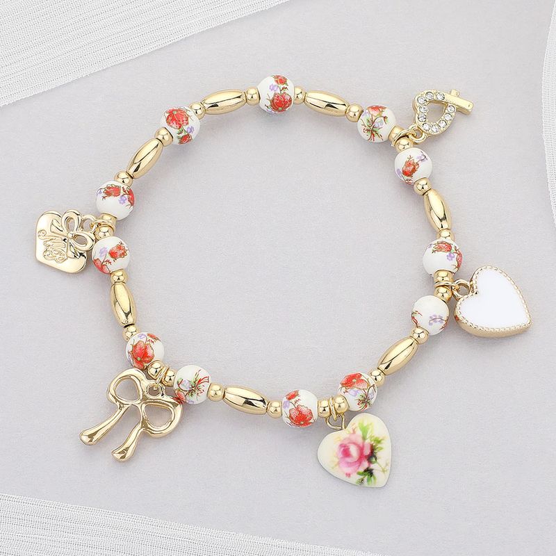 Metal Bow Enamel Heart Charm Floral Ceramic Ball Beaded Stretch Bracelet