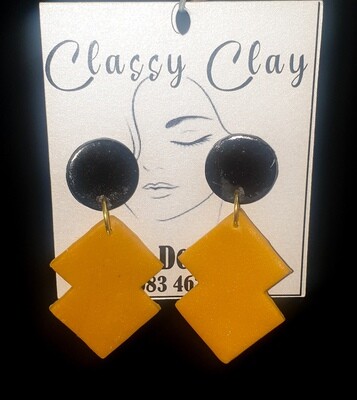 Double rectangular mustard hanging with black stud earrings