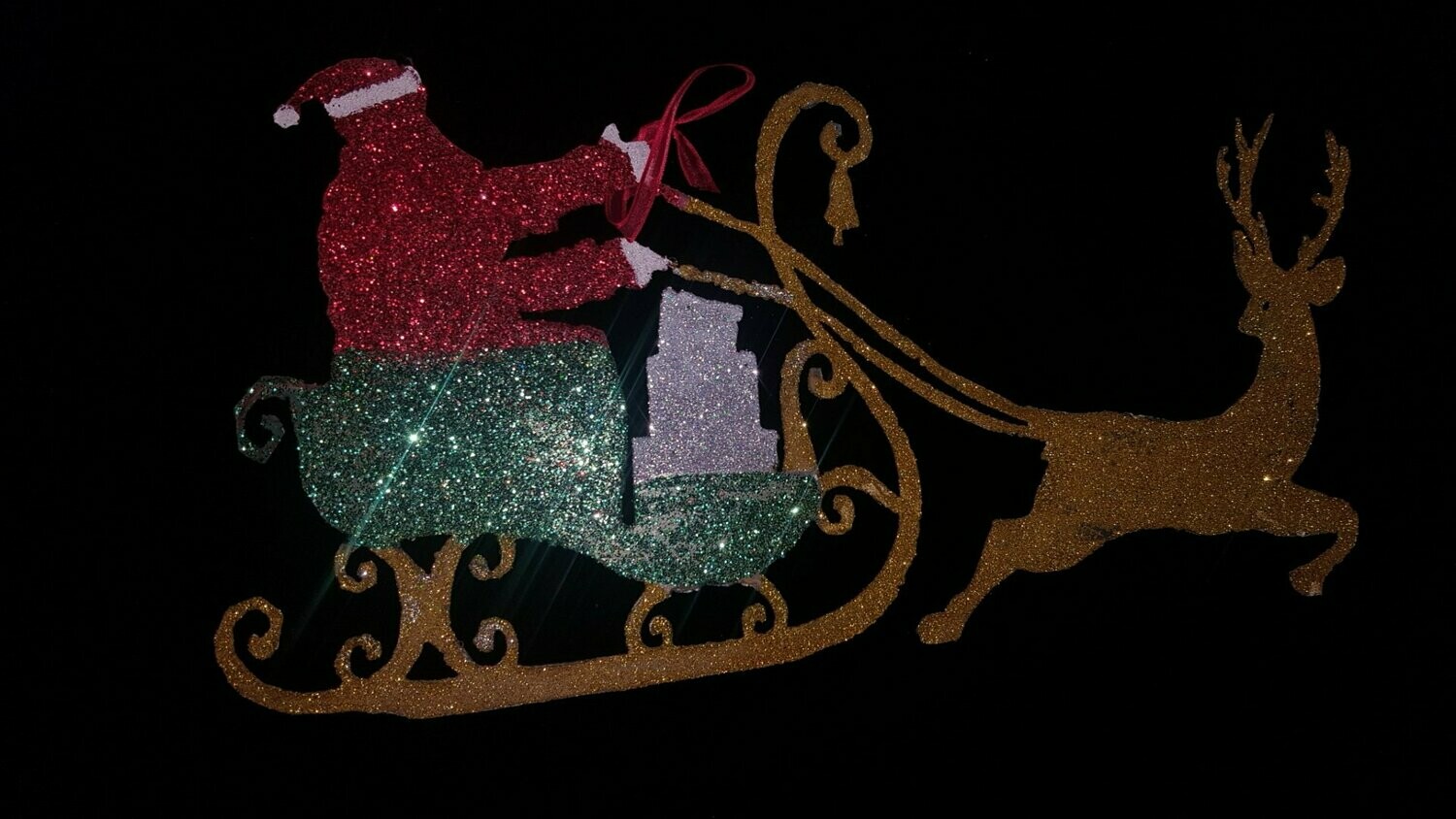 papa noel en trineo con brillantina
