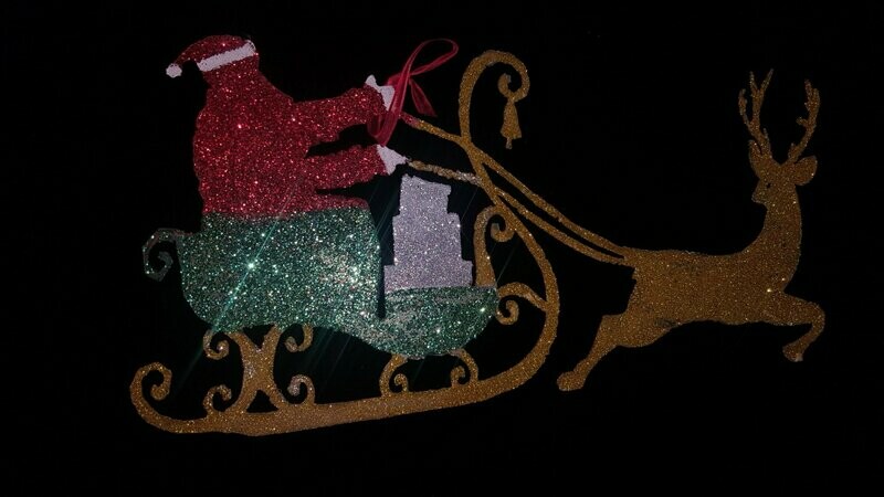 papa noel en trineo con brillantina
