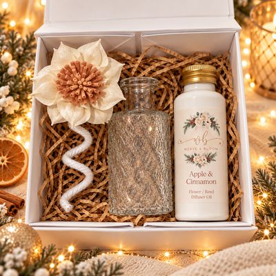 Luxury Weave & Bloom Christmas gift hampers featuring festive wax melts, wax melt burners and flower diffusers, beautifully p