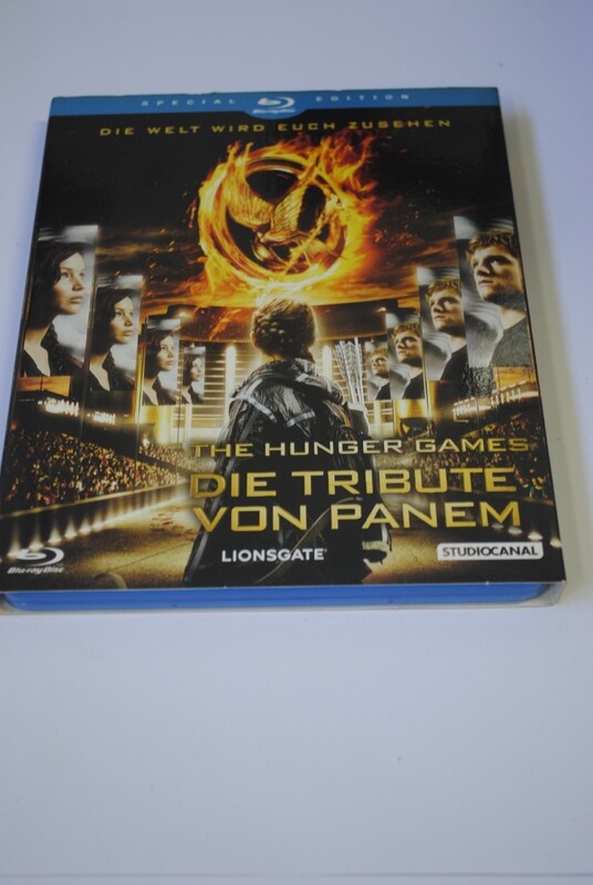 DIE TRIBUTE VON PANEM mit Pappschuber DIE TRIBUTE VON PANEM mit Pappschuber