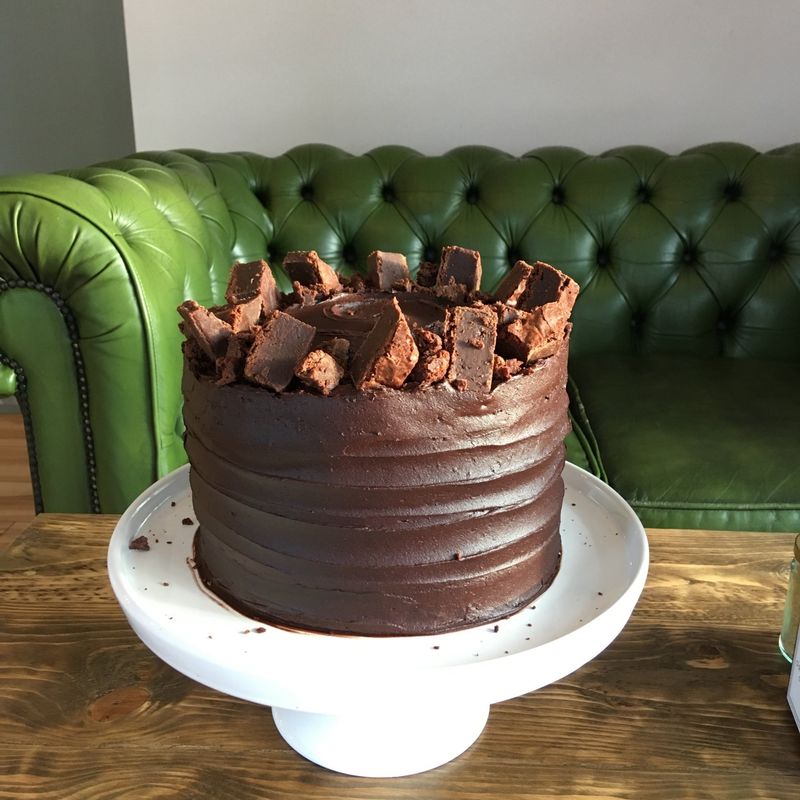 Chocolate fudge - A simple crowd pleaser! A celebration of all things chocolate, with layers of rich sponge and whipped chocolate frosting, crowned with chunky brownie pieces.