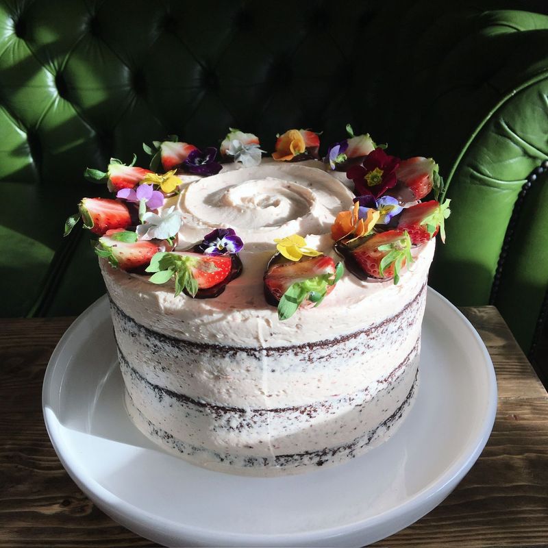 Chocolate Strawberry - Light and fresh, filled with our house-made strawberry jam and finished with a silky Swiss meringue buttercream made with real strawberries, chocolate dipped strawberries and edible flowers.