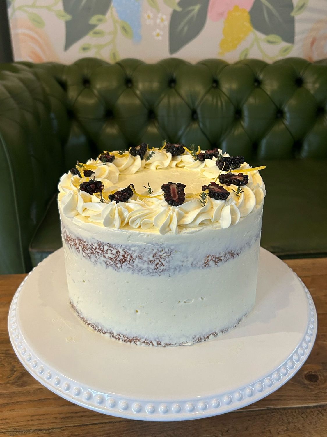 Lemon, Blackberry & Thyme - A beautifully balanced flavour combo – lemon and thyme drizzle sponge filled with house-made blackberry jam and lemon Swiss meringue buttercream. Decorated with fresh blackberries and sprigs of thyme for a natural and elegant finish.