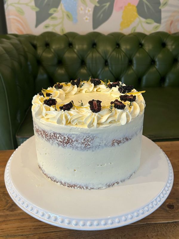 Lemon, Blackberry & Thyme - A beautifully balanced flavour combo – lemon and thyme drizzle sponge filled with house-made blackberry jam and lemon Swiss meringue buttercream. Decorated with fresh blackberries and sprigs of thyme for a natural and elegant finish.