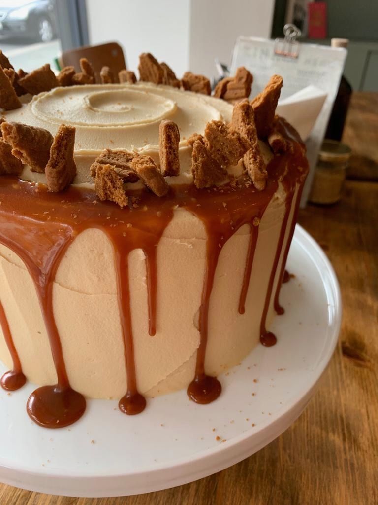 Salted Caramel Biscoff Cake - Sweet, spiced, and seriously moreish — this cake is always a hit! Made with soft buttermilk sponge swirled with Lotus Biscoff spread and crushed biscuits, layered with caramel buttercream, and finished with a caramel drip and a crown of Speculoos shards. A true crowd-pleaser with that irresistible Biscoff twist.