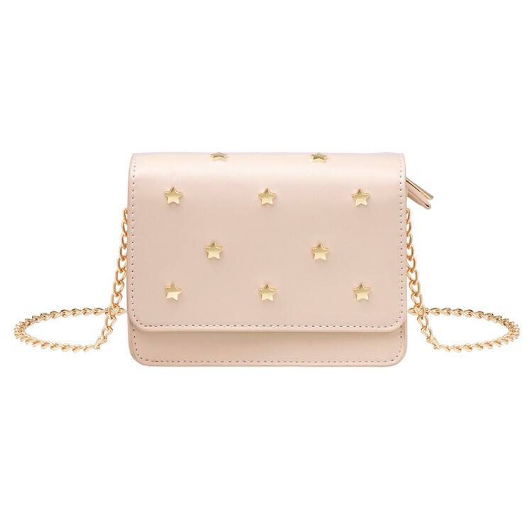 Handtas met ster studs en kettingriem
