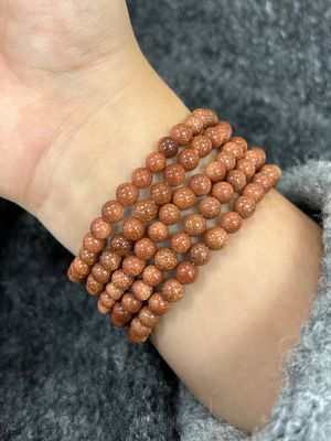 goudsteen armband 6/8mm (veel glitter, man made)
