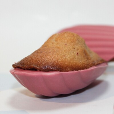 Madeleines with ruby chocolate shell