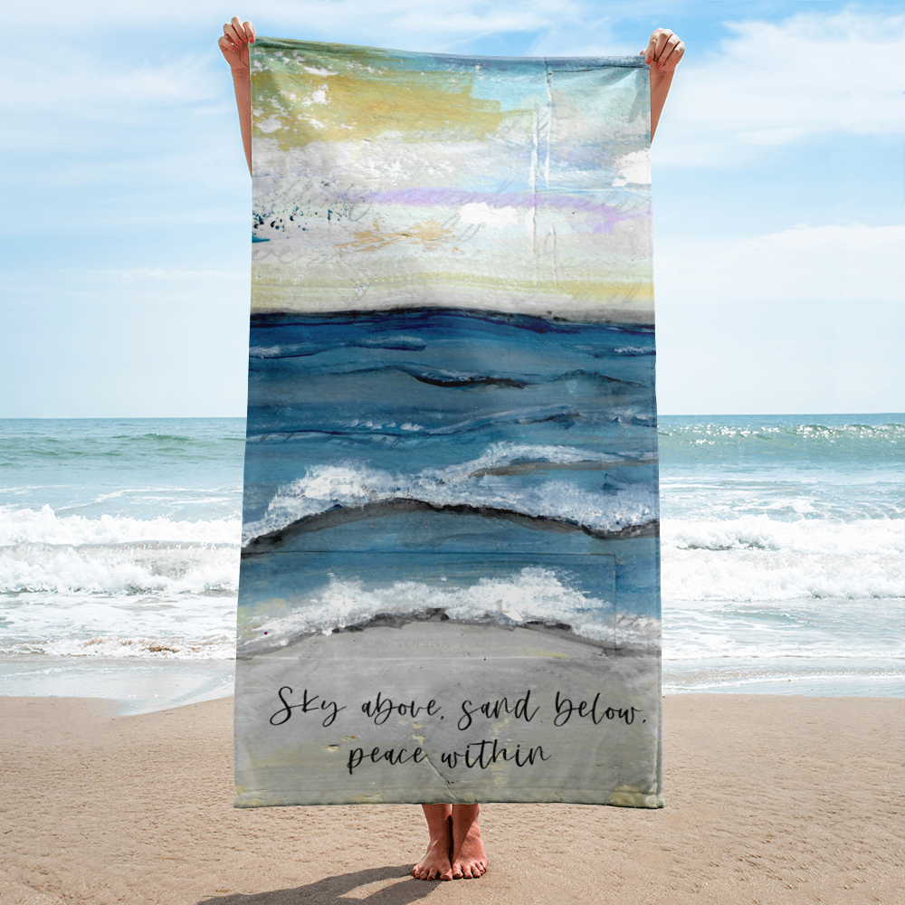 Sky above, sand below, peace within Beach Towel