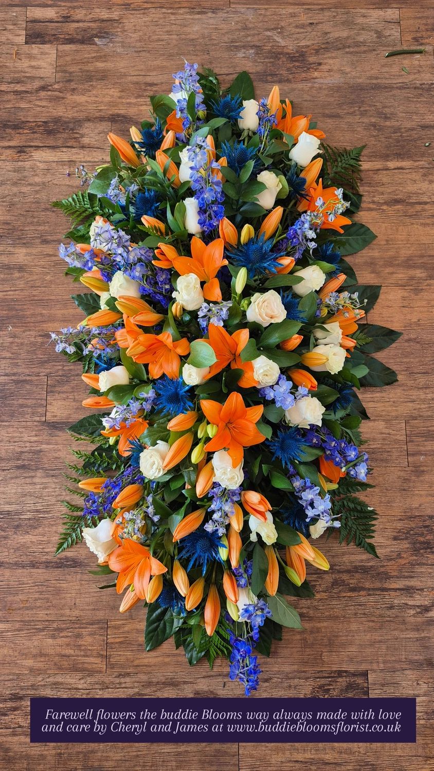 Orange Lilly &amp; Blue thistles Casket spray 4 foot 