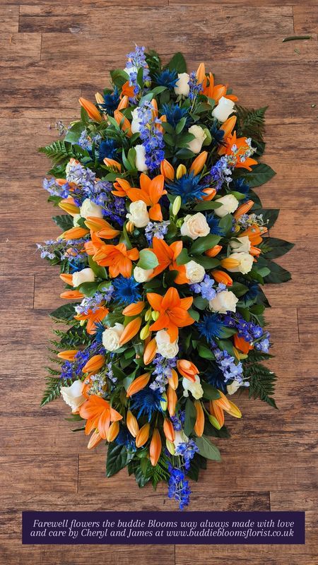 Orange Lilly &amp; Blue thistles Casket spray 4 foot 