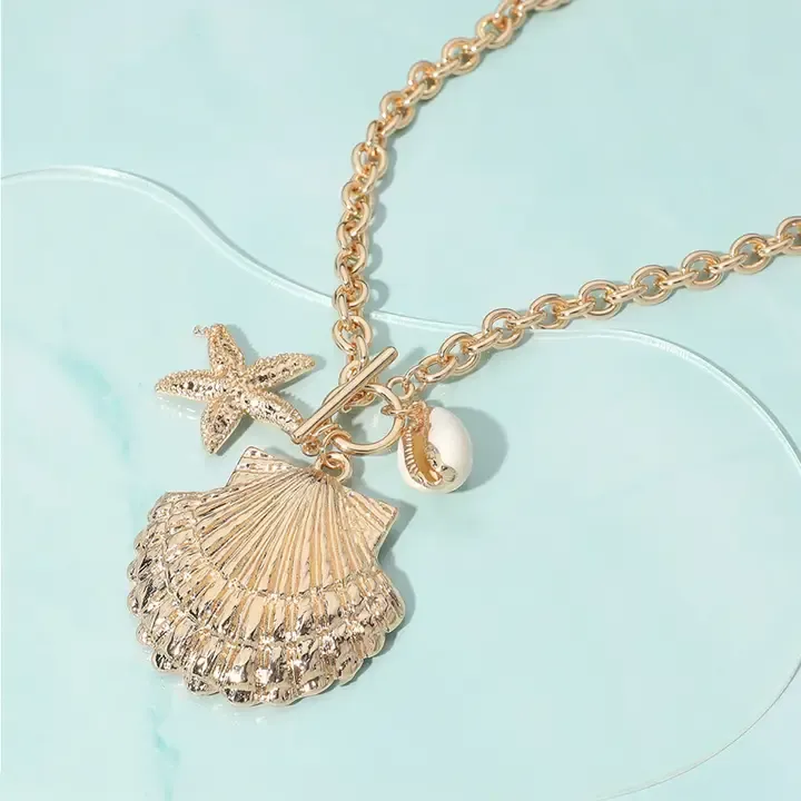 Gold Seashell Pendant With Starfish Charm Necklace