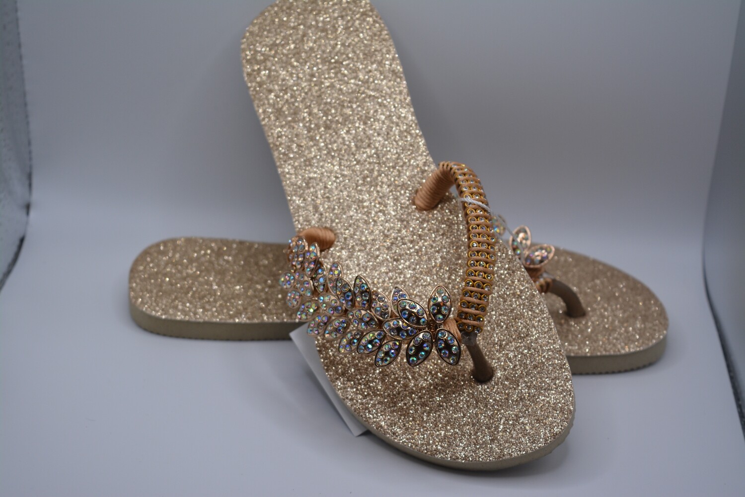 gold sparkly flip flops