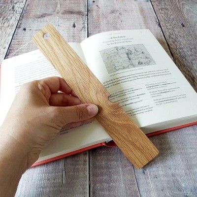 Rustic oak wood bookmark with beautiful grain detail and missing knot