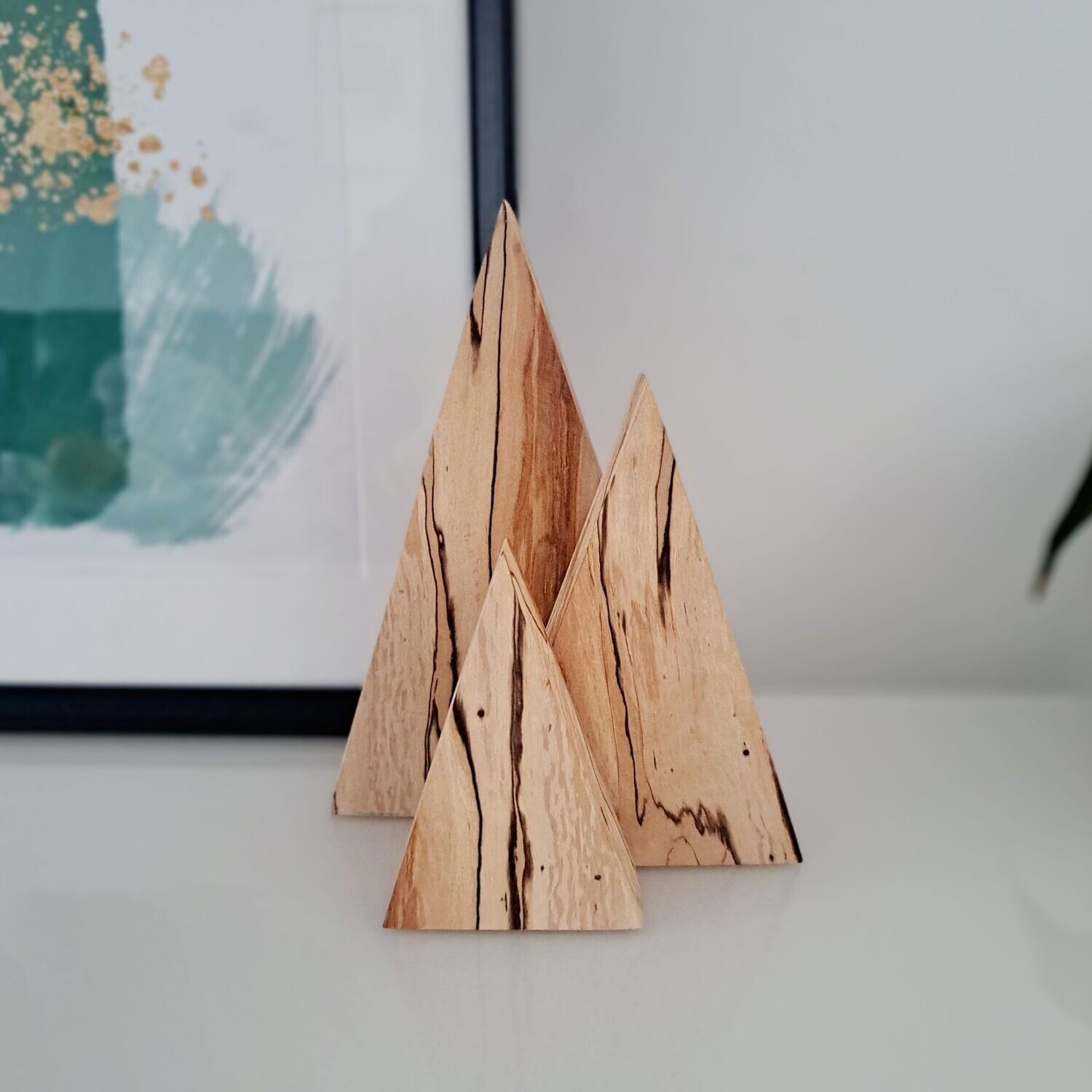 Trio of wooden mountains