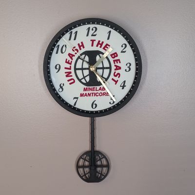Manticore Metal Detecting Pendulum Wall Clock