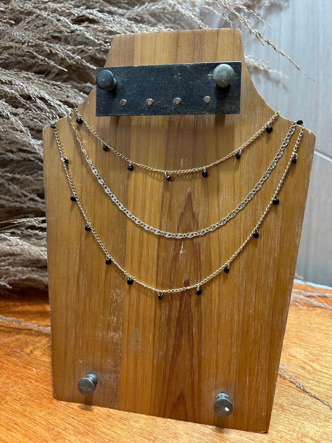 Three-Layer Necklace With Small Black Charms 