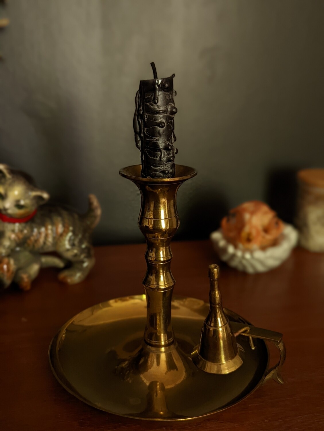 Brass candle holder with snuffer